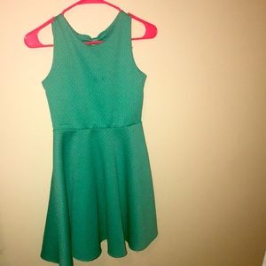 This is a turquoise dress that’s has been warm but is in great shape.